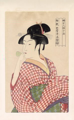 Beauty Blowing a Glass Pipe