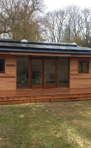 garden room with solar panels and skylights