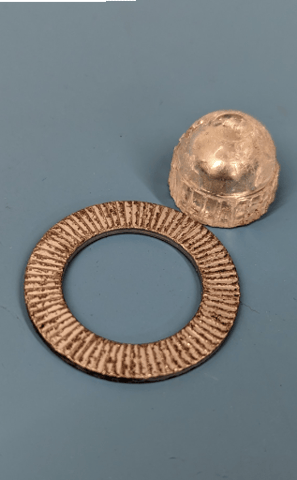 a metal object with a ring on it