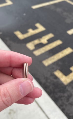 a person holding a ring with a ring on it