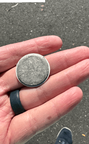 a person holding a coin with a coin