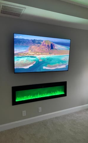 Hidden wire TV install with electric fire place