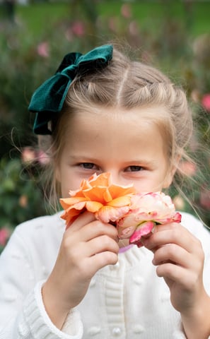 a little girl with a flower in her hair