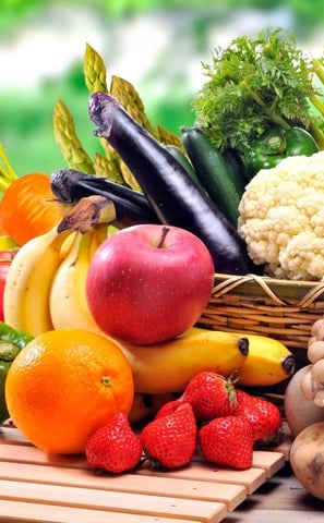 a basket of fruits and vegetables on a table