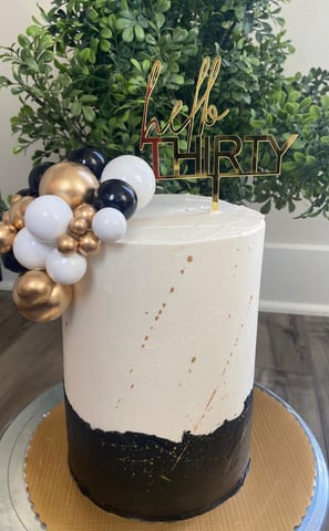 a cake with a hello kitty cake topperf