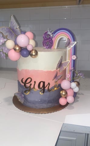 a cake with a rainbow - colored cake and a rainbow - colored cake