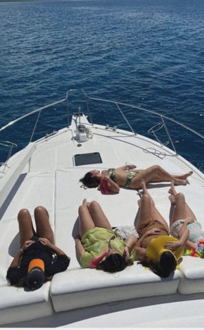 a group of people laying on a boat
