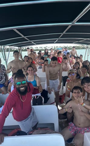a group of people on a boat in the water