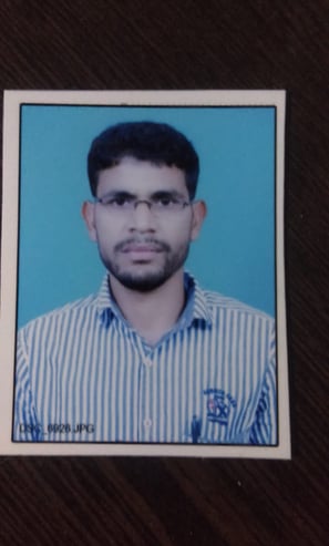 a man in a striped shirt and glasses