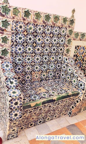 Fun looking patio chair covered with old colorful tiles in National Palace of Sintra