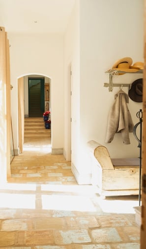 Charming hallway with a coat hanger and bench at Finca Santa Katerina