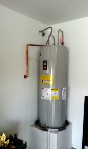 a water heater with a water heater on top of it