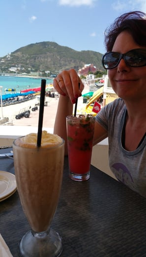 Lady enjoys a drink on St. Maarten