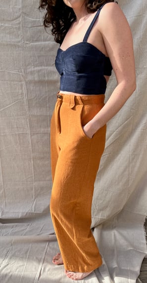 A navy corduroy bustier and honey brown flannel pants