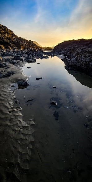 Oregon Coast - Scenery of ocean tidepool waters at sunset
