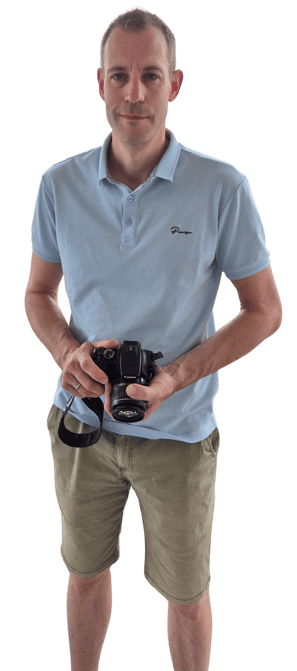 a man holding a camera and taking a picture