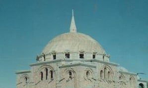 a large building with a dome shaped building on top of it