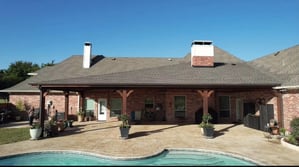 Bricked house extented covered patio.