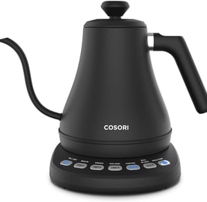 a black coffee potted on a scale with a digital scale