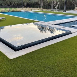 Artificial turf installation in Atherton backyard with clean, modern edging