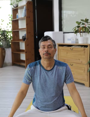 an image of a senior citizen doing yoga 