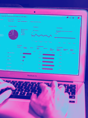 Typing on computer with analytics on webpage