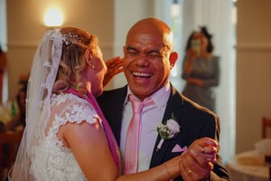 Groom smiling during first dance at wedding in Fátima