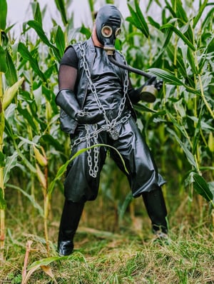 FTSH Studios model (s) Oscar Thickk UK Fetish Model wearing farmerrain bodysuit, gloves, gas mask, chain