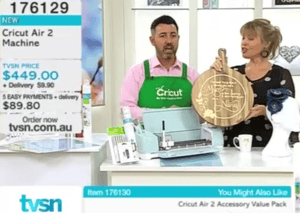 a man and woman standing in front of a counter top