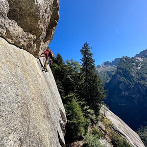 A climber on Luna Nascente, pitch 2. Val di Mello, Italy