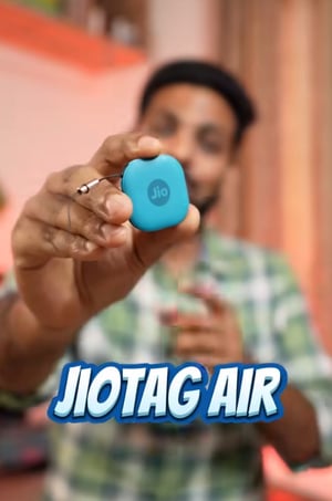 person holding jio tag device 