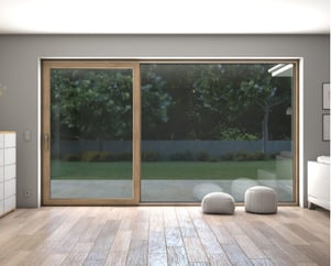 a room with a sliding glass door and a white dresser