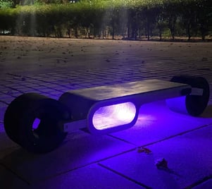 “Futuristic electric skateboard with LED lighting—innovative design for modern urban commuting.”