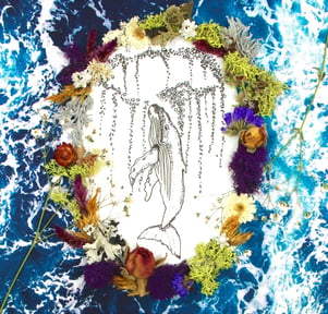 humpback whale drawing surrounded by flowers and ocean 