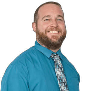 a man with a beard and a tie on a blue shirt