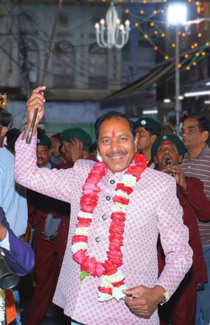 The owner of Manohar Brass Band mastering the band group during a live session.