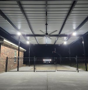 Black Fence with Fan Above