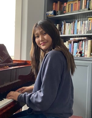 Musician sitting at a piano