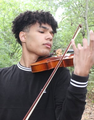 Musician playing the violin outside