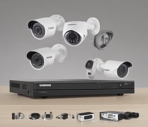 A close-up view of the back of a server rack with multiple network cables connected to a switch. The cables are in different colors including white, orange, black, and light blue. There are also various ports, indicators, and a digital display indicating some operational parameters.