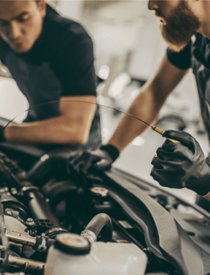 Expert mechanics performing an oil change, ensuring top performance and longevity for your vehicle