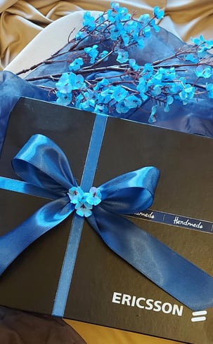 Beautifully packed black and blue box for Ericsson Pakistan.  Hand-painted pen holders corporate gifts