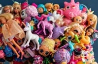 A beautiful collection of upcycled plastic items on a glam kitsch mirror