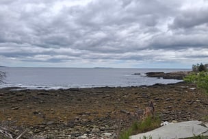 A photo showing the rocky Maine coast and ocean