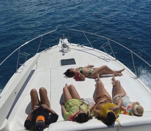 a group of people laying on a boat