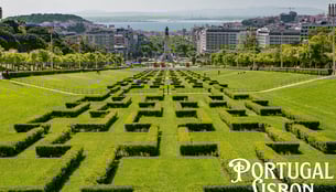 a large maze maze in a park with a view of the city Lisbon,Portugal