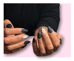 a woman's hands with matte nails and accent snowflake nail