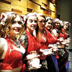 Ruby star bellydancers in red costumes performing candle dance in Utah