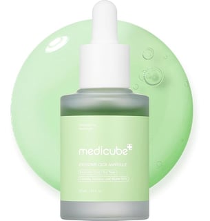 a bottle of moisturizing water with a green and white background