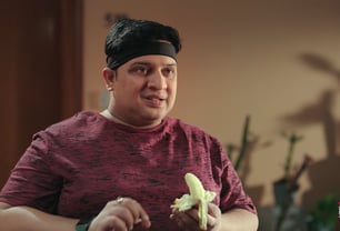 Man in red shirt with a banana, Aditya Satyajit, Big Basket, One For Love, Ad Film